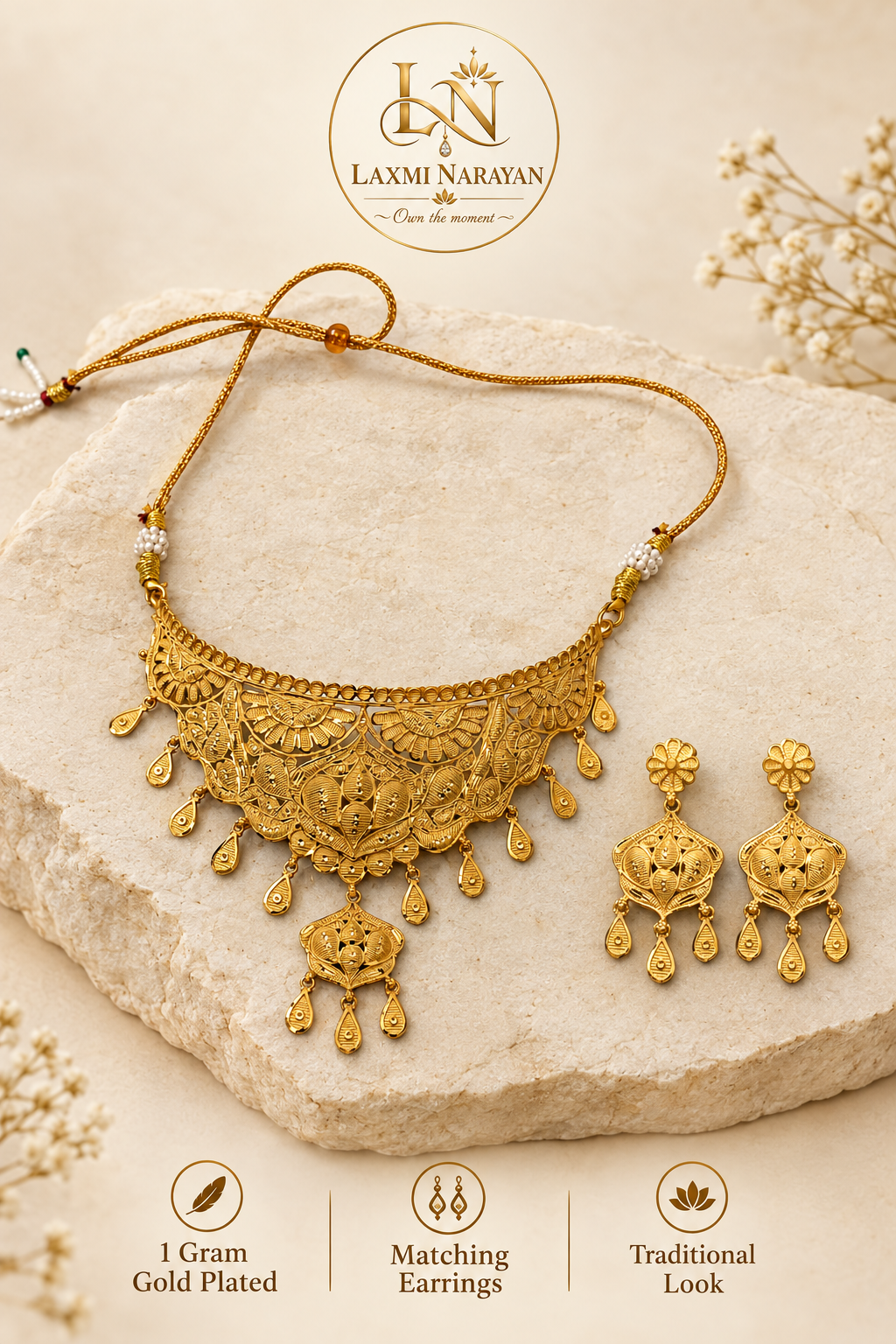 Leaf design necklace and earrings on cream stone