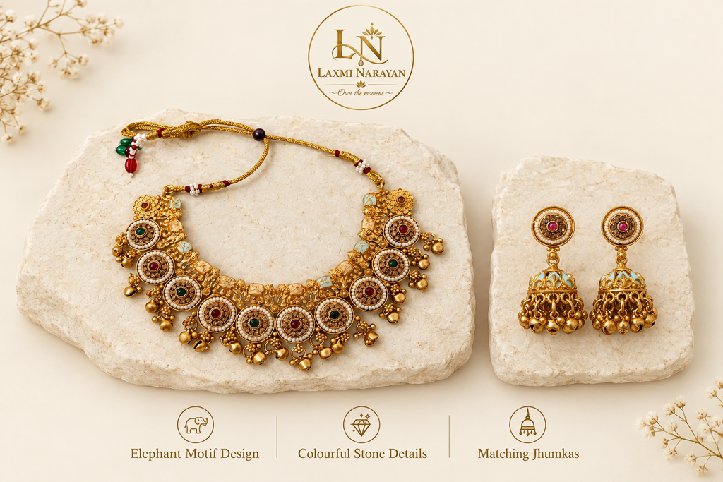 Necklace and matching earrings on separate cream stones