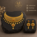 Floral necklace and matching earrings on black stone